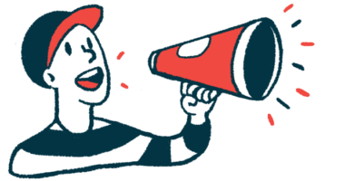 A person wearing a baseball cap uses a megaphone to make an announcement.