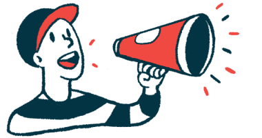 A person in a baseball cap uses a megaphone to make an announcement.