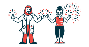 A clinician and a patient standing side by side each give the thumbs up sign with both hands, with fireworks seen going off behind them.