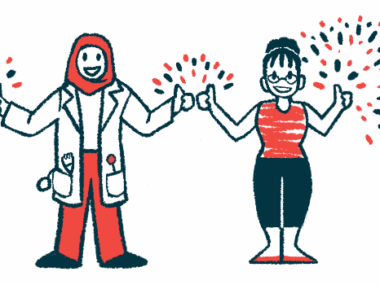 A clinician and a patient standing side by side each give the thumbs up sign with both hands, with fireworks seen going off behind them.
