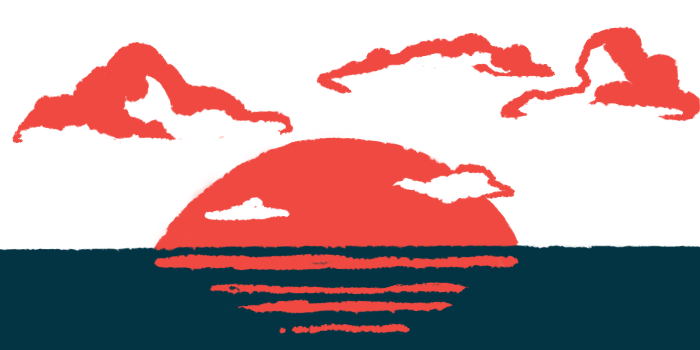 The sun is seen setting over water.