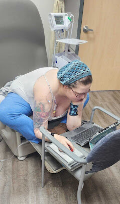 Shawna working on her laptop