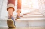 a close-up of a woman's feet as she walks up steps