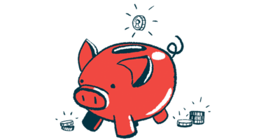 A coin is seen dropping into the top slot of a pig-shaped bank.