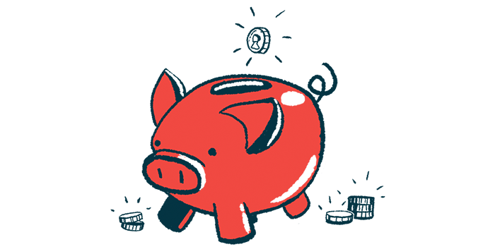 A coin is seen dropping into the top slot of a pig-shaped bank.