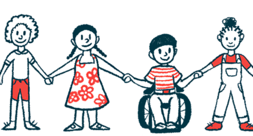 Four children, one in a wheelchair, hold hands in a row.