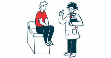 A doctor talks to a patient sitting on an examination table.