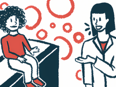 A doctor speaks to a child who's sitting on an exam table.