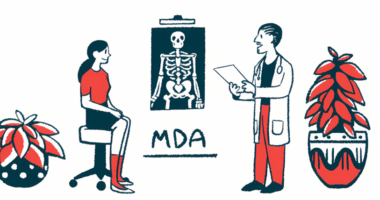 A doctor stands while speaking to seated patient, with an X-ray hanging on the wall between them and the letters MDA underneath the X-ray.