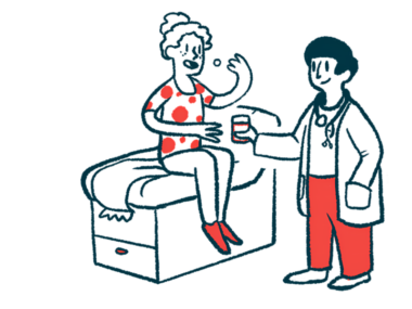 A patient sitting on an exam table takes a pill while a doctor holds a glass of water.