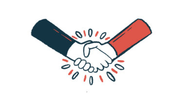 A pair of hands engage in a handshake.