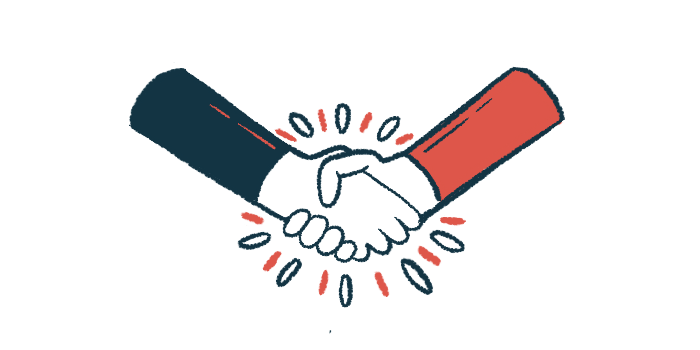 A pair of hands engage in a handshake.